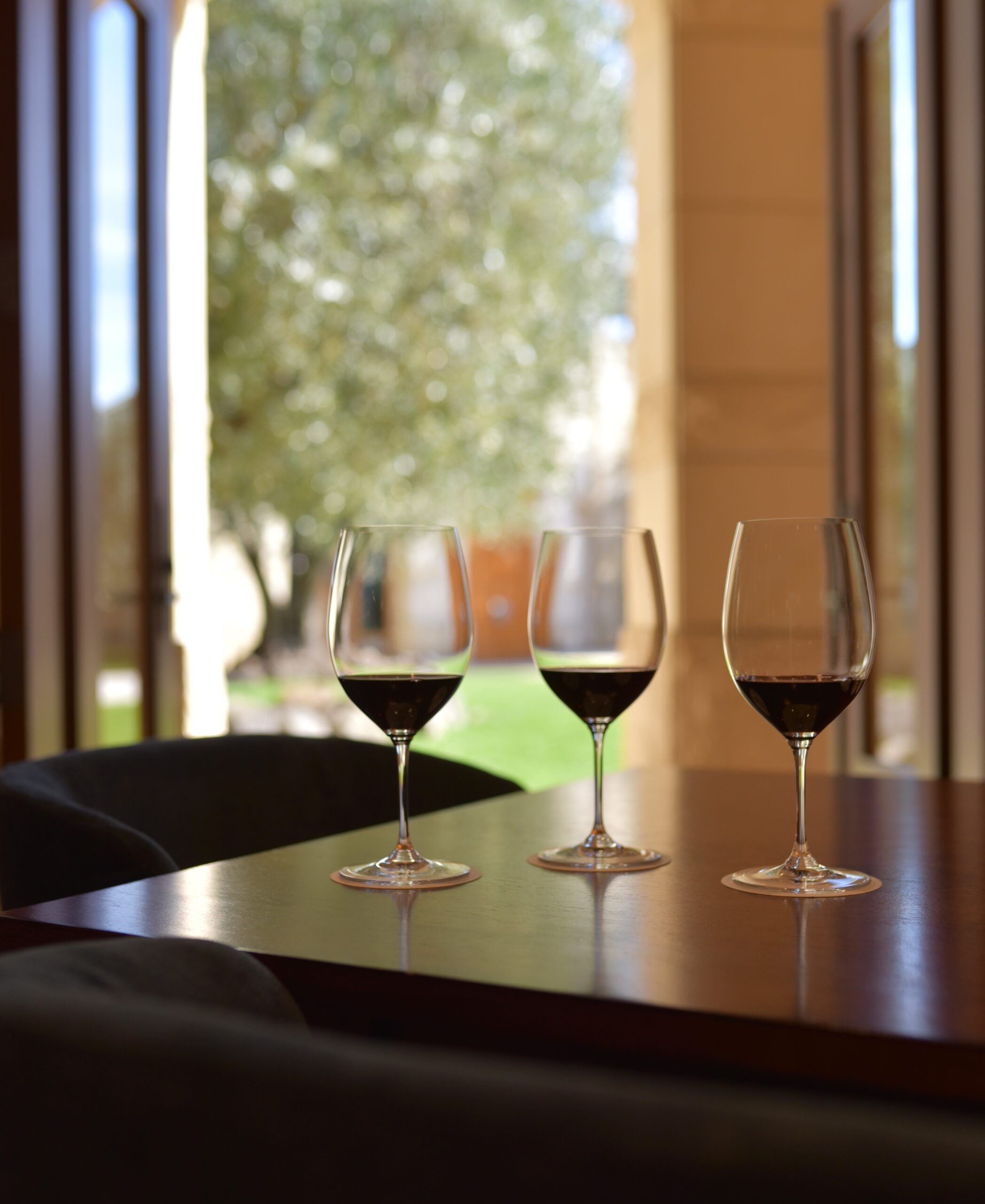 A Napa Valley winery tasting experience of two Opus One vintages and a second wine, Overture. The Courtyard tasting experience overlooks century old olive trees and neoclassical limestone architecture.